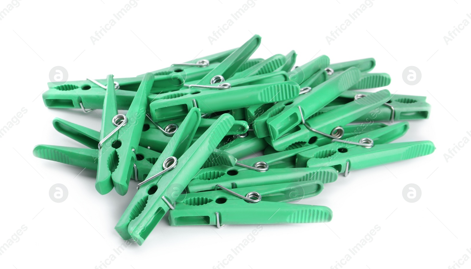 Photo of Bright green plastic clothespins on white background