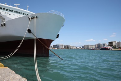 Modern ferry moored in sea port on sunny day