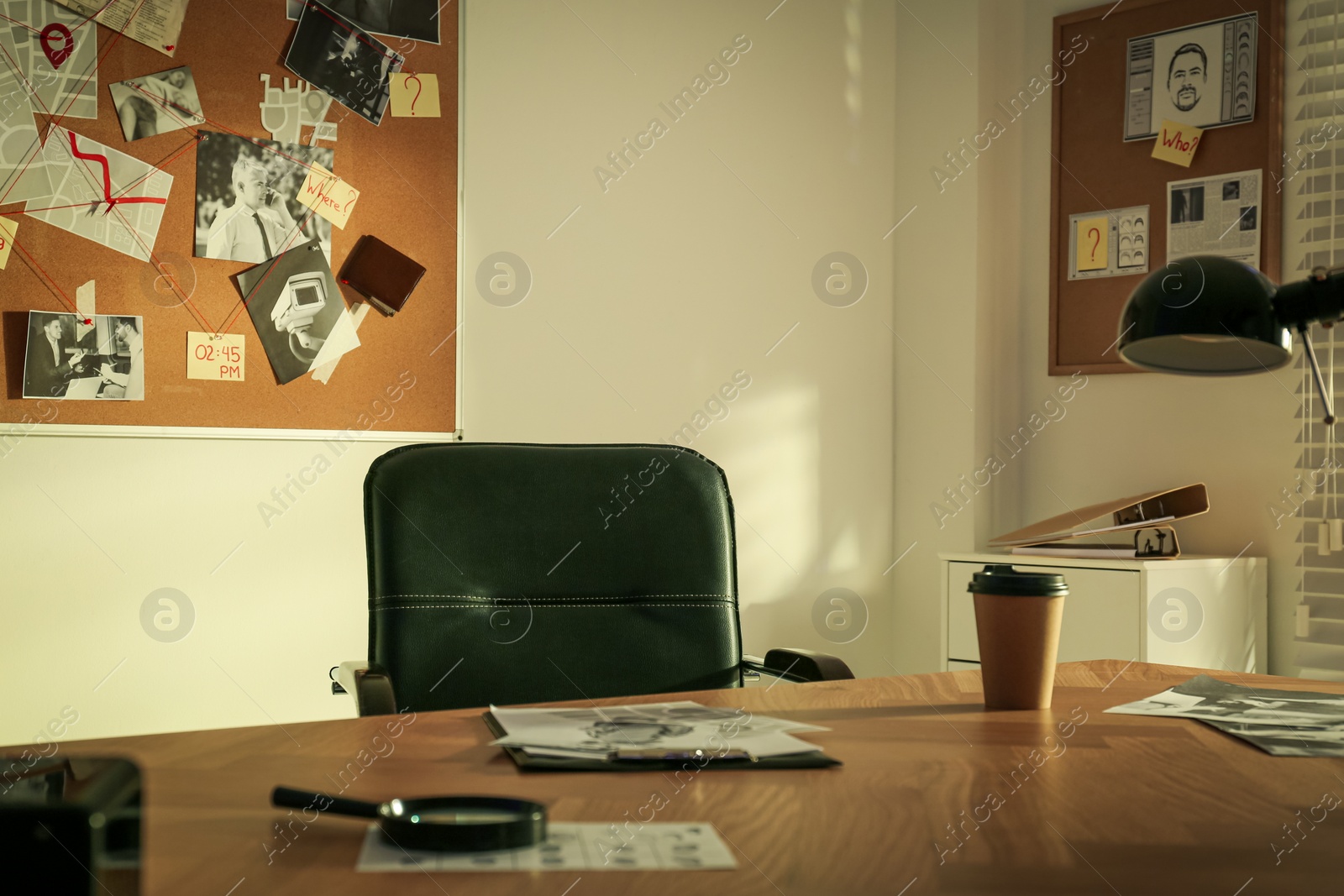 Photo of Detective workplace and evidence board in modern office