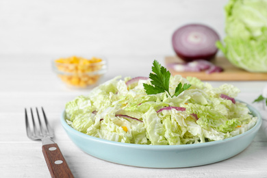 Fresh napa cabbage salad served on white table, closeup