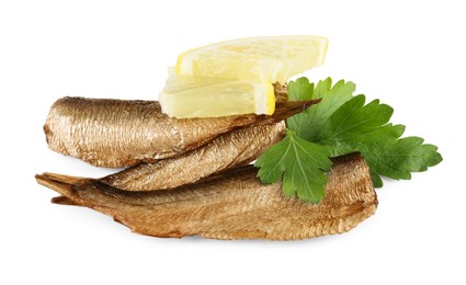 Tasty canned sprats, lemon and parsley isolated on white