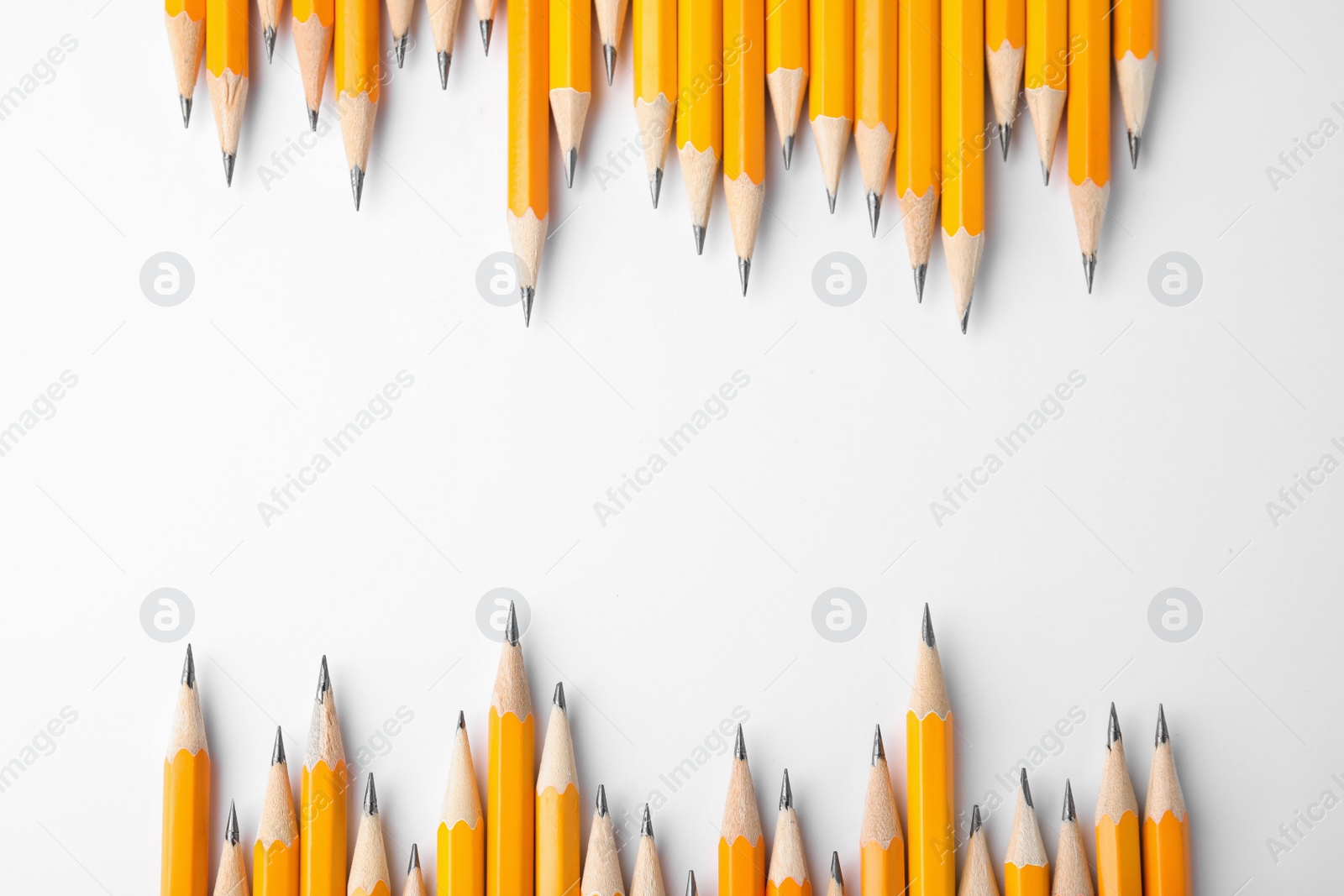 Photo of Graphite pencils on white background, top view. Space for text