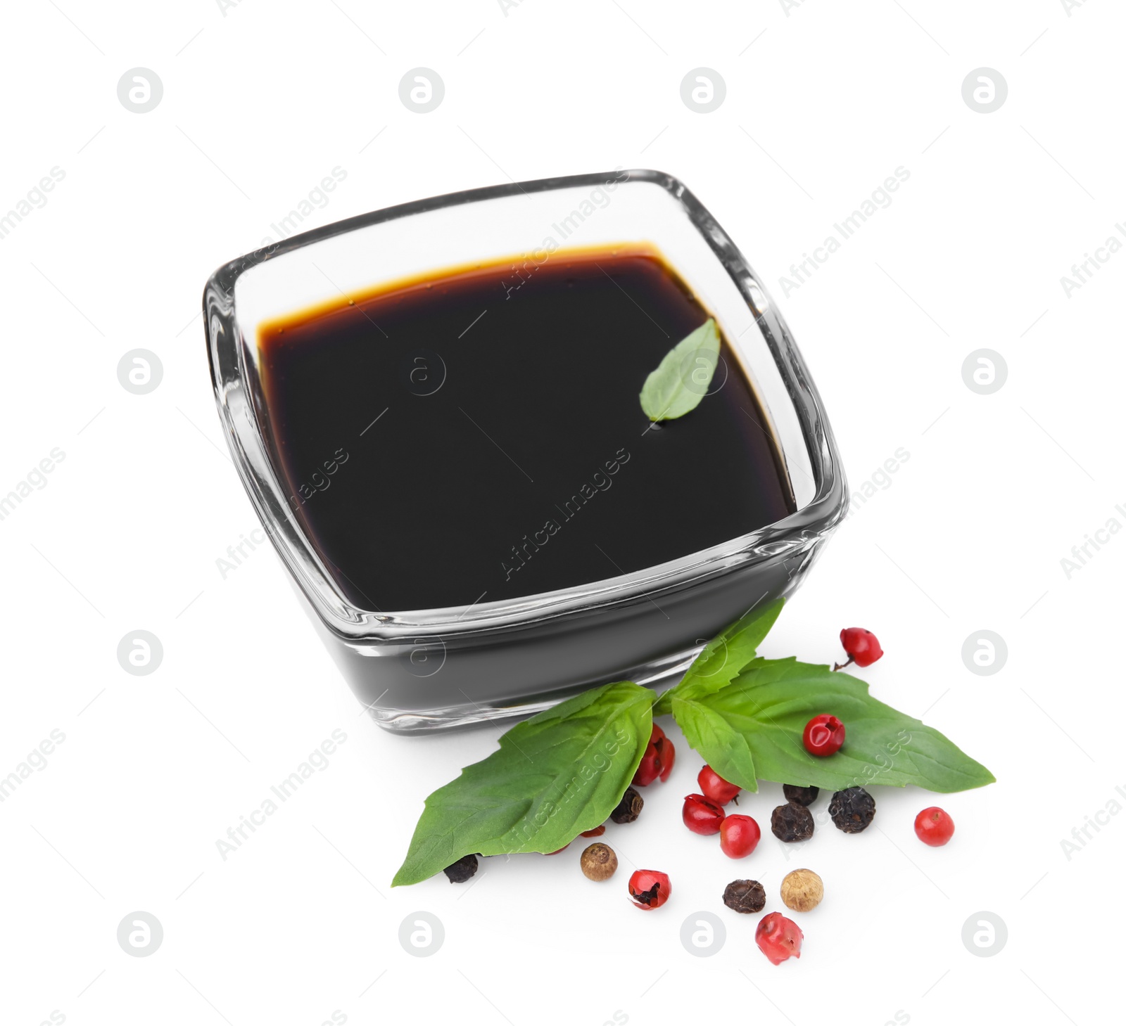 Photo of Organic balsamic vinegar, basil and pepper isolated on white