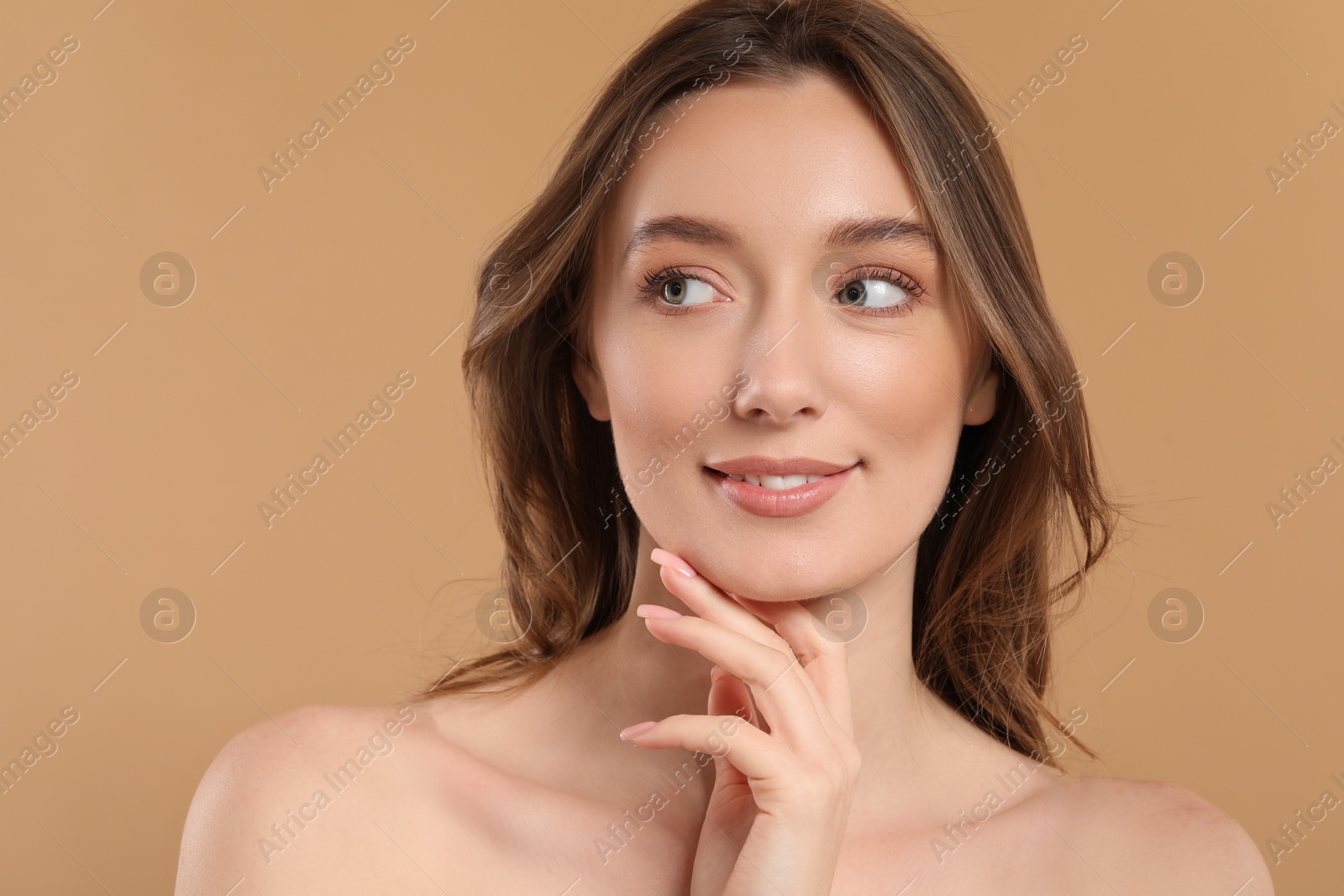 Photo of Beautiful woman with healthy skin on beige background, space for text