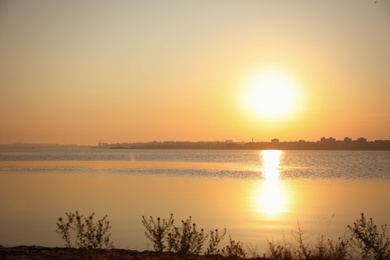 Photo of Picturesque view of beautiful sunrise on riverside. Morning sky