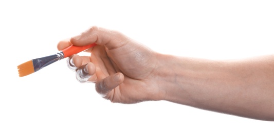 Man holding paint brush on white background, closeup