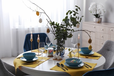 Photo of Beautiful Easter table setting with festive decor indoors