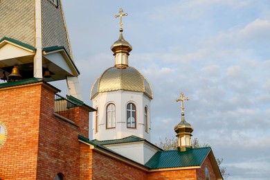 Beautiful view of village church against blue sky