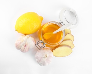 Photo of Composition with garlic and other cold remedies on white background, top view