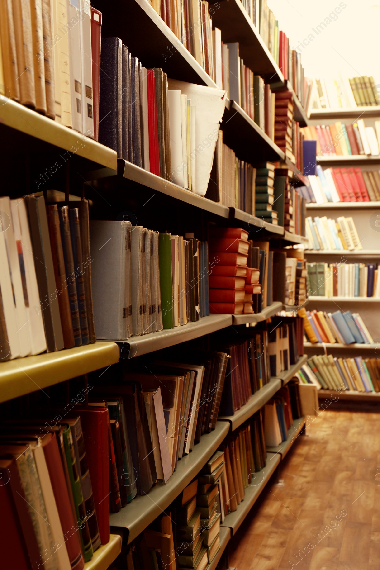 Image of Collection of different books on shelves in library