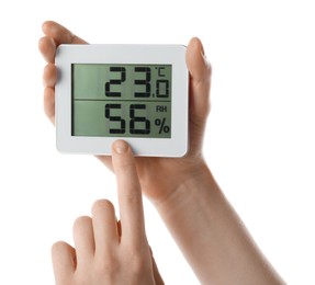 Photo of Woman holding digital hygrometer on white background, closeup