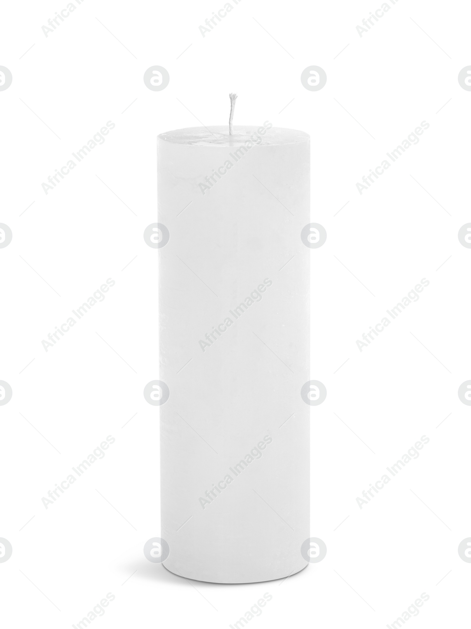 Photo of New pillar wax candle on white background