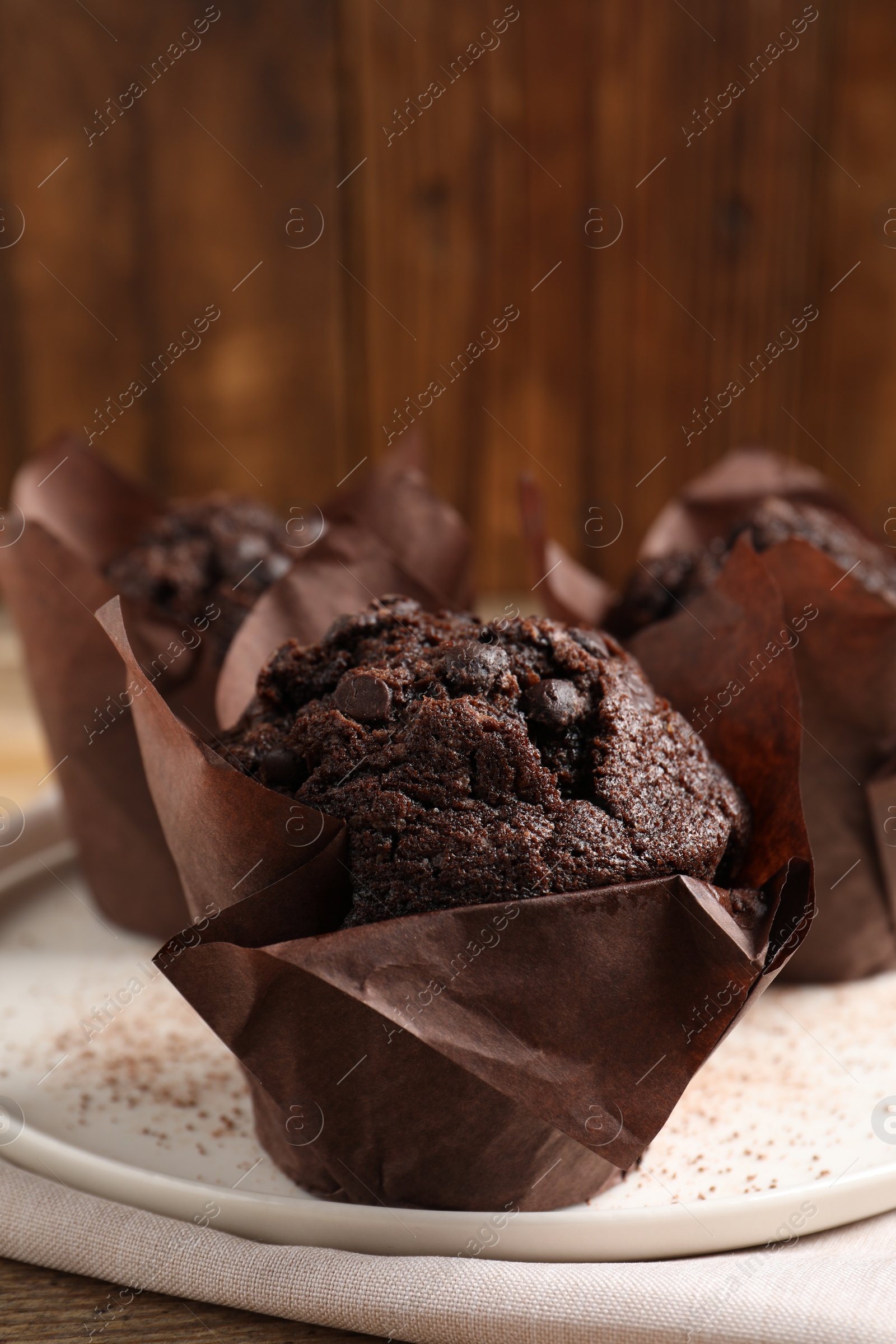 Photo of Tasty chocolate muffins on table, closeup view