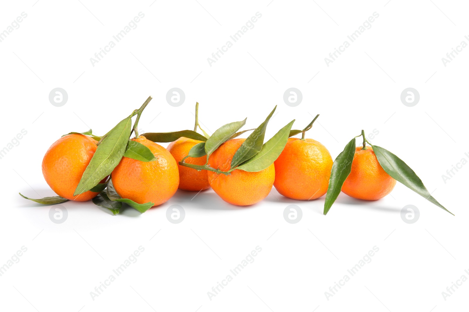 Photo of Tasty ripe tangerines with leaves on white background