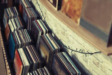 Image of Rack and shelf with different vinyl records in store