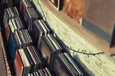 Rack and shelf with different vinyl records in store