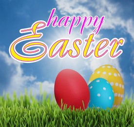 Image of Happy Easter. Bright eggs on green grass outdoors 