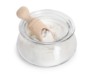 Baking powder in glass jar and scoop isolated on white