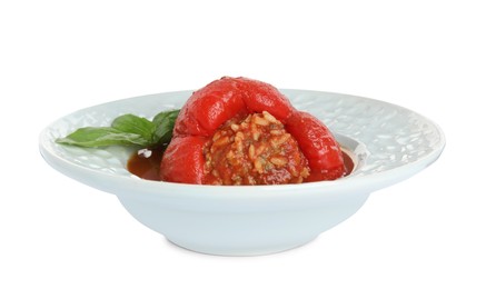 Photo of Delicious stuffed pepper with basil in bowl isolated on white