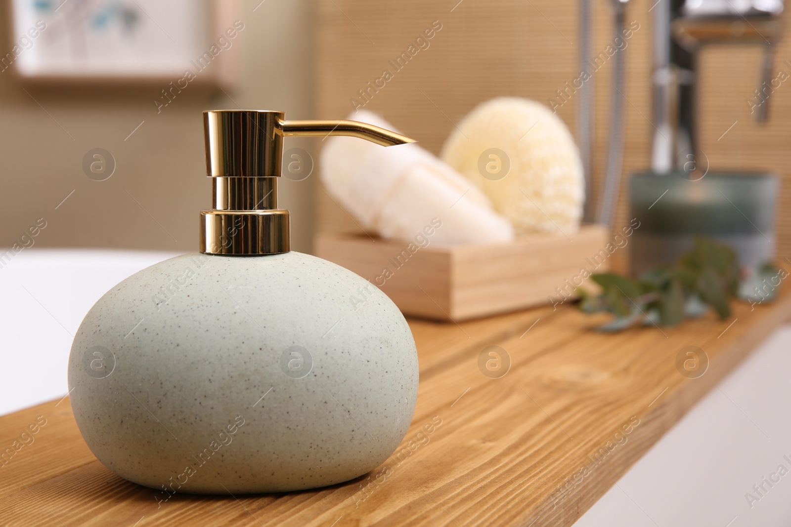 Photo of Dispenser of liquid soap on bath tray indoors. Space for text