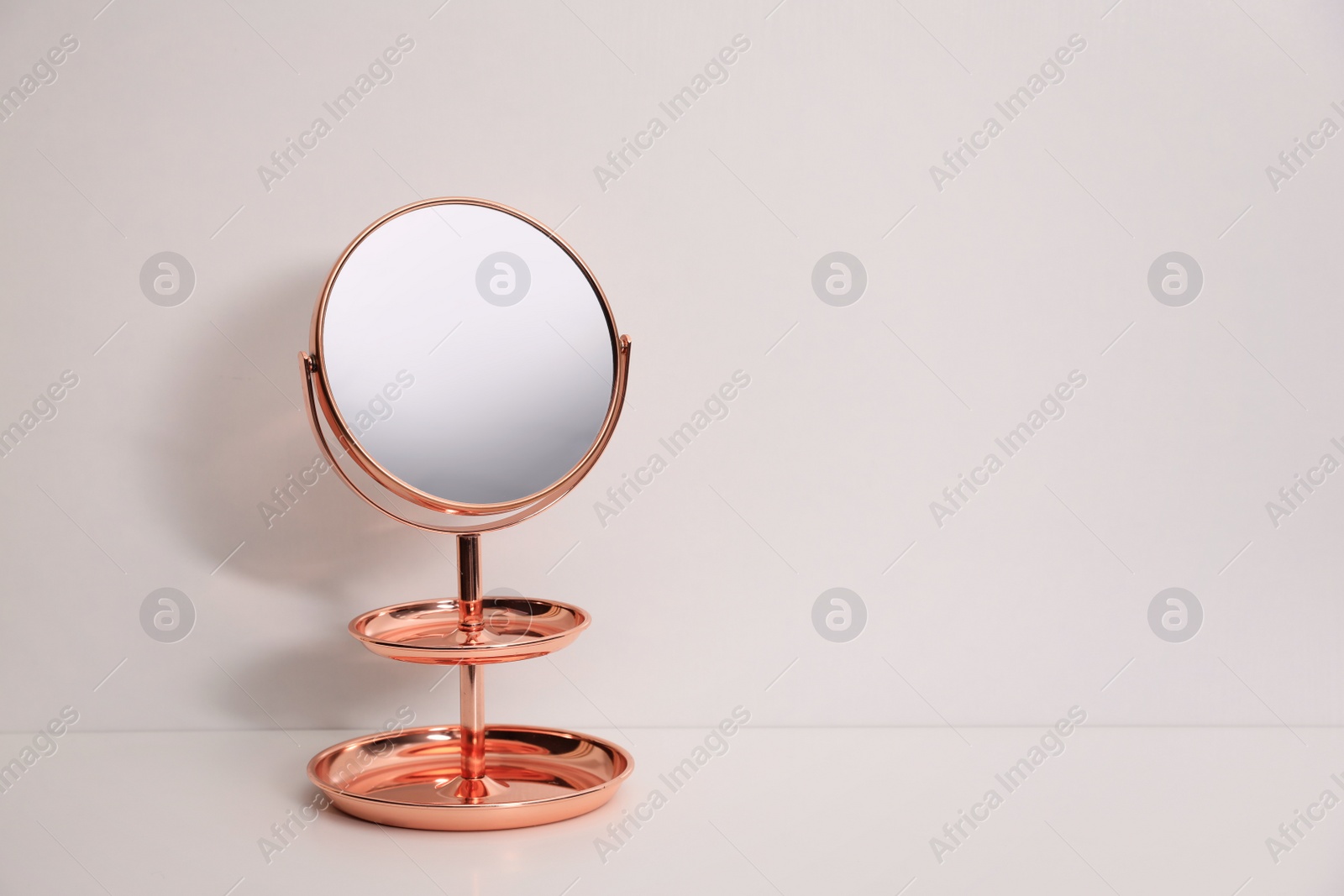 Photo of Stylish mirror with stand on white background, space for text