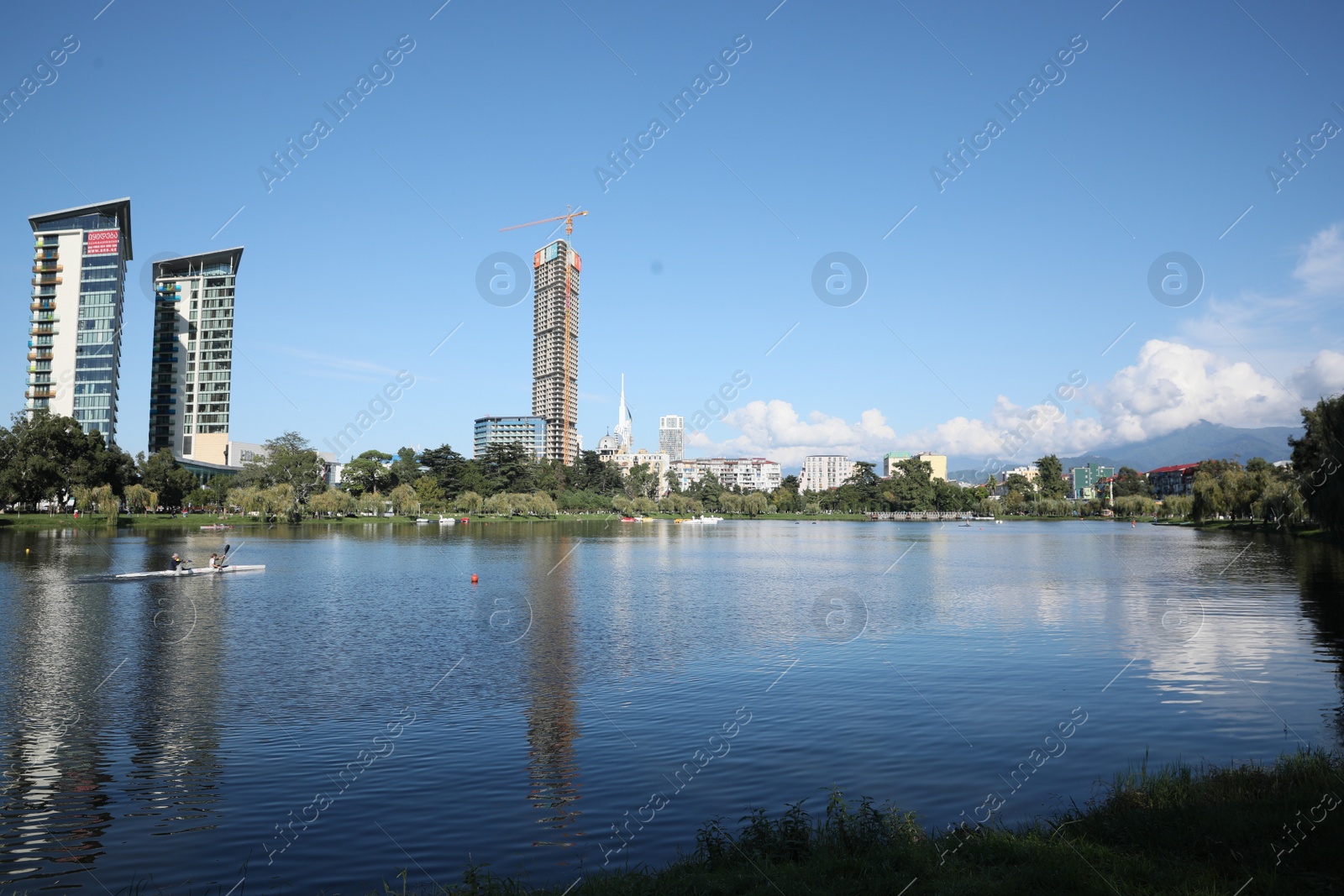 Photo of Batumi, Georgia - October 12, 2022: Picturesque view of city near Nurigeli lake and mountains