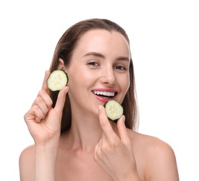 Photo of Beautiful woman with pieces of cucumber on white background