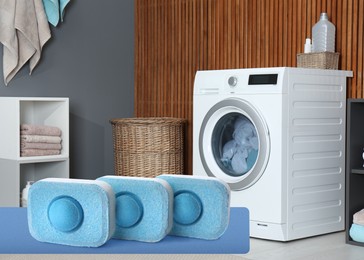 Image of  water softener tablets and modern washing machine in laundry room