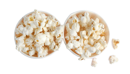 Photo of Buckets of tasty pop corn isolated on white, top view