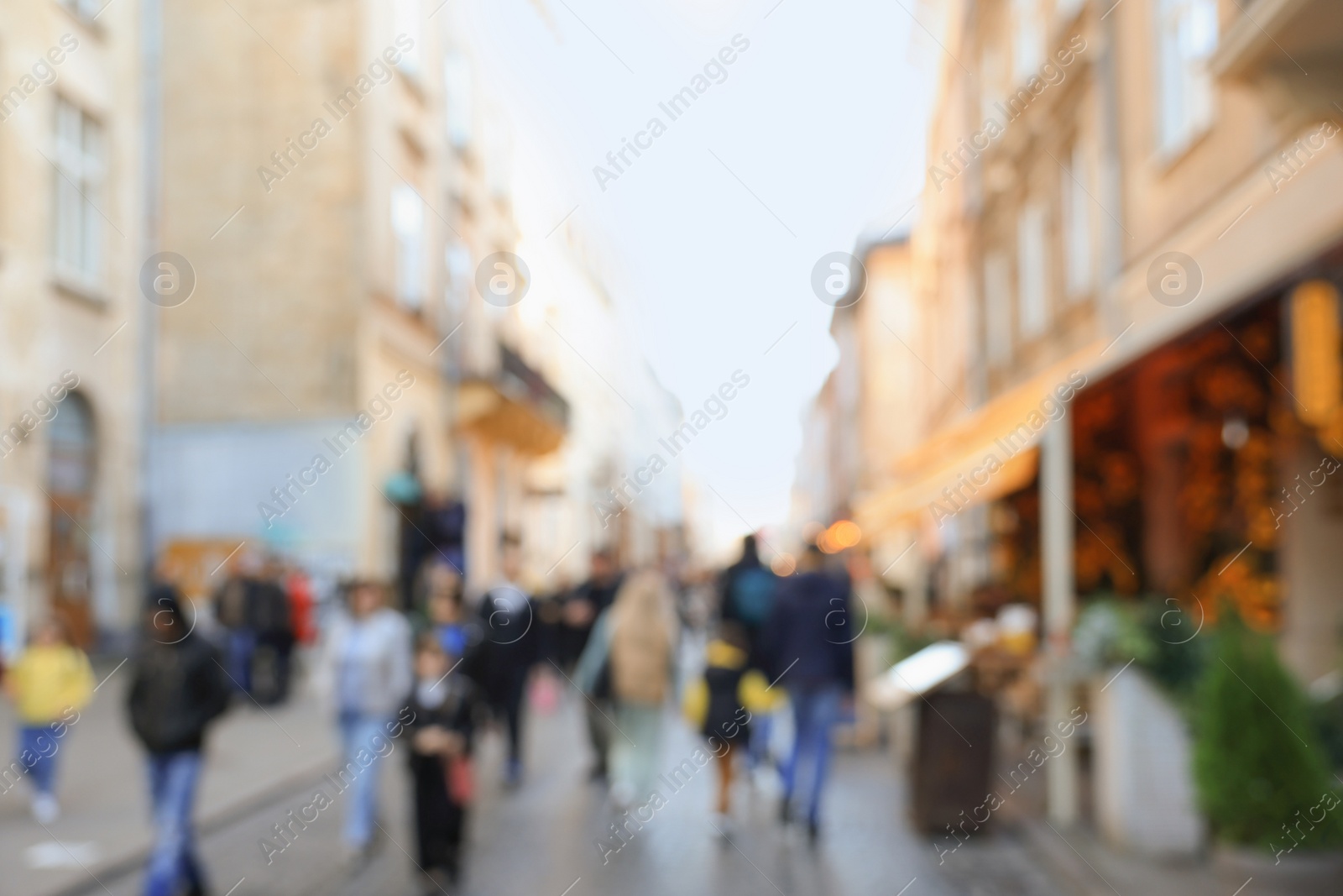 Photo of Blurred view of people walking on city street