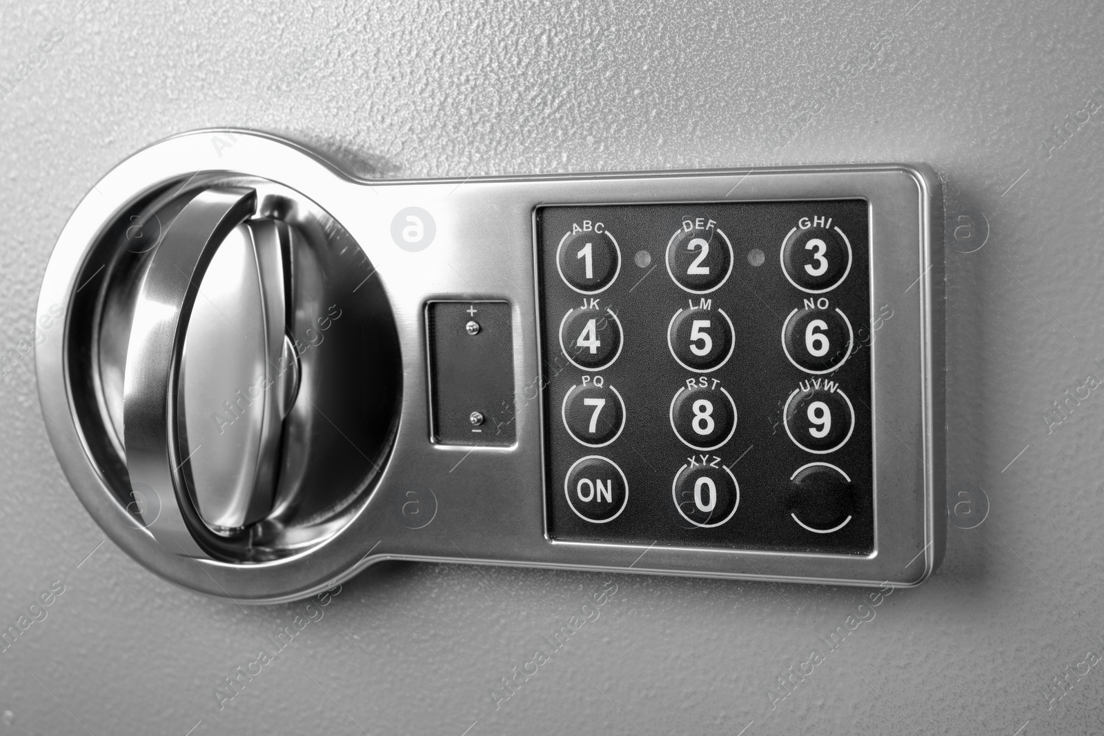 Photo of Grey steel safe with electronic lock, closeup