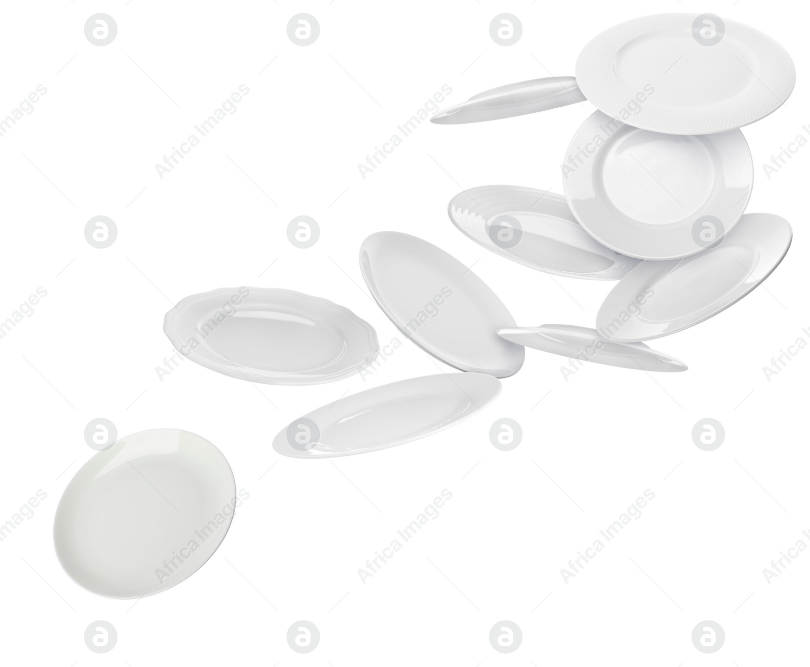 Image of Many ceramic plates falling on white background