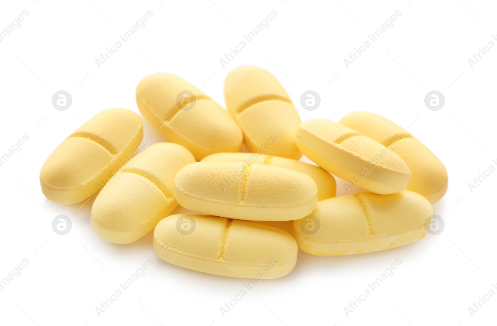 Photo of Pile of color pills on white background