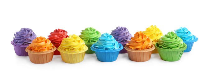 Photo of Tasty cupcakes with bright cream isolated on white