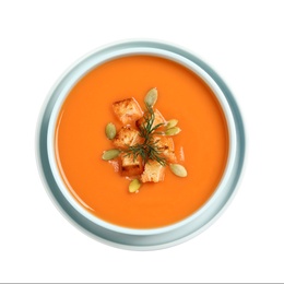 Photo of Tasty creamy pumpkin soup with croutons, seeds and dill in bowl on white background, top view