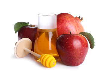 Honey, apples and pomegranate on white background. Rosh Hashanah holiday