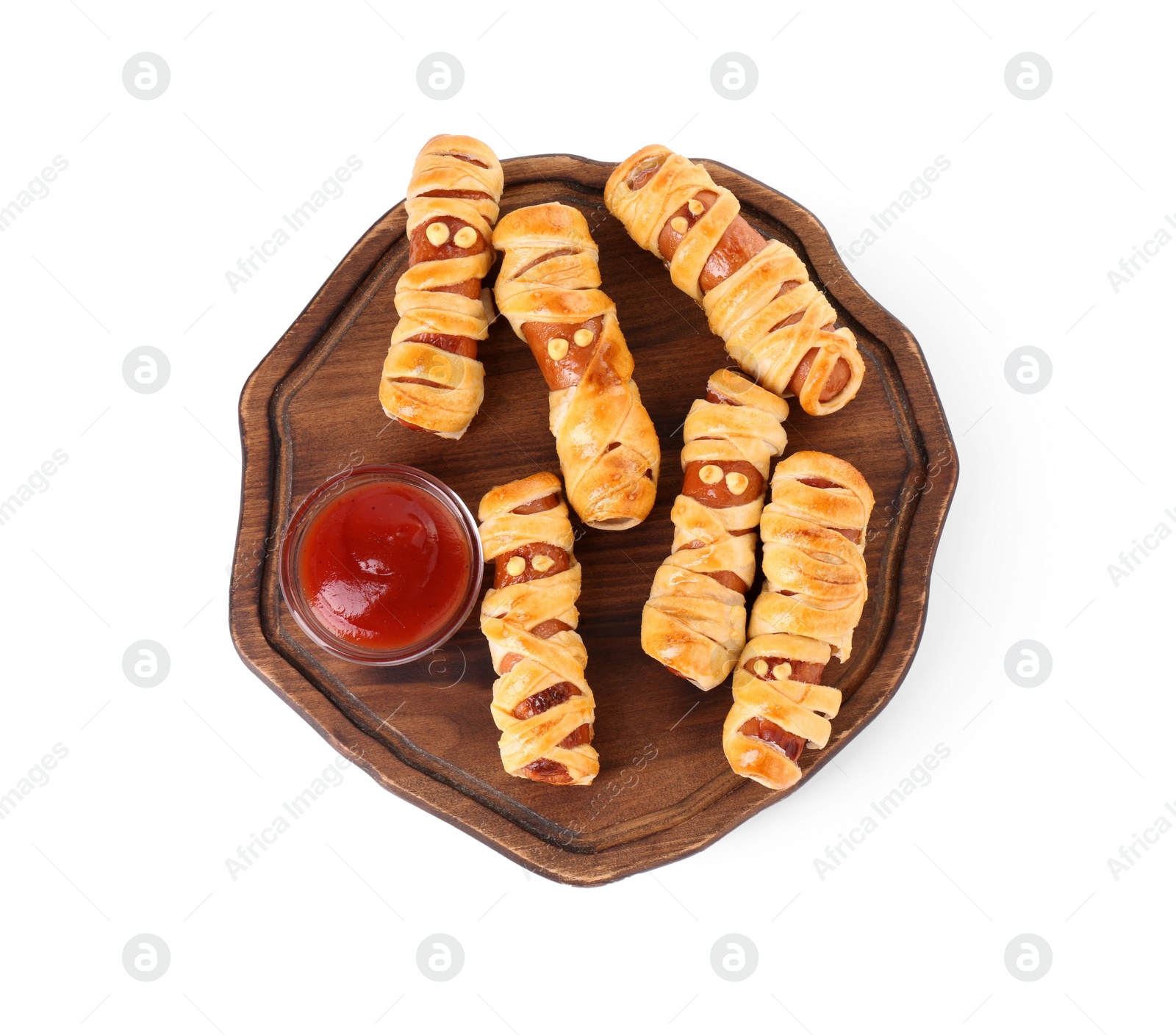 Photo of Cute sausage mummies served with ketchup isolated on white, top view. Halloween party food