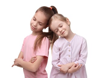 Portrait of cute little sisters on white background