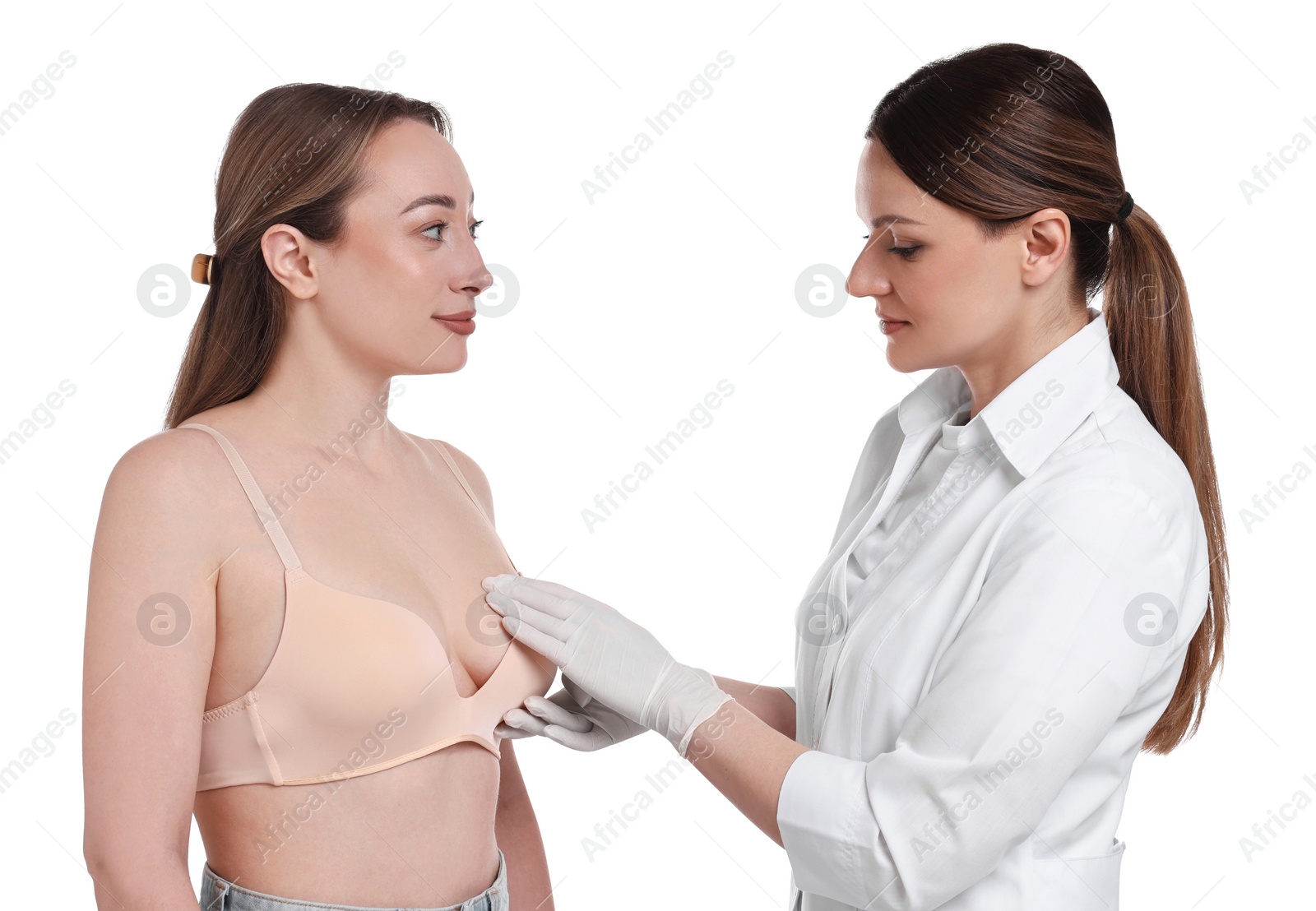 Photo of Mammologist checking woman's breast on white background