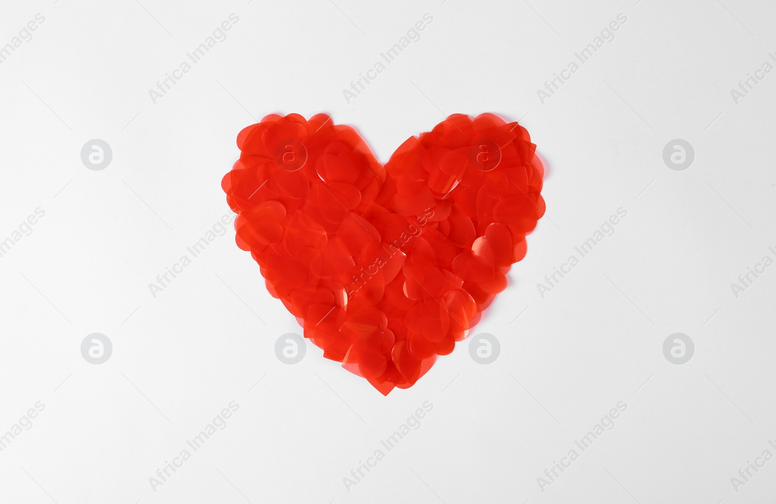 Photo of Heart made of decorative elements on white background, top view