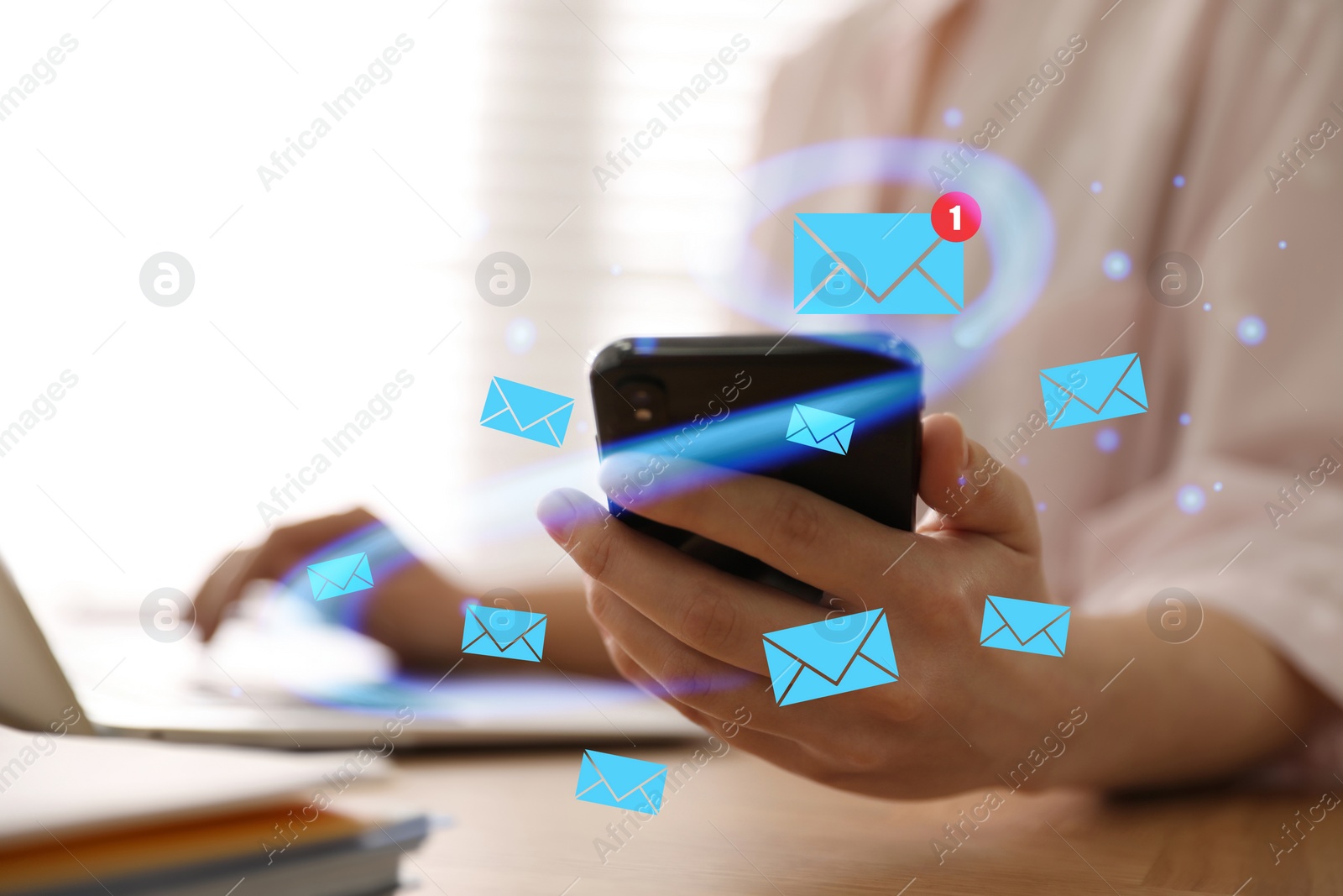 Image of Email. Woman using mobile phone and laptop at table, closeup. Letter illustrations around device