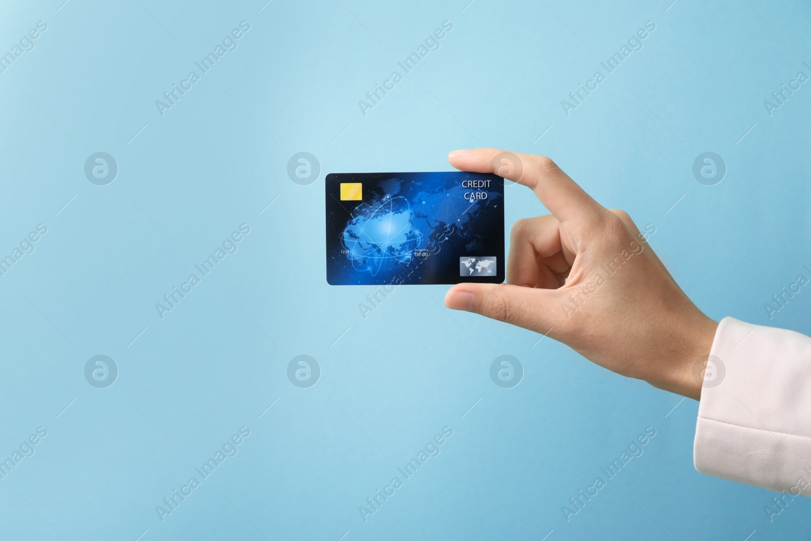 Photo of Woman holding credit card on color background