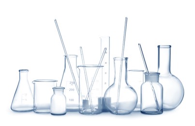 Photo of Empty clean laboratory glassware on white background