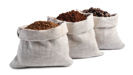 Photo of Bags with different types of coffee on white background