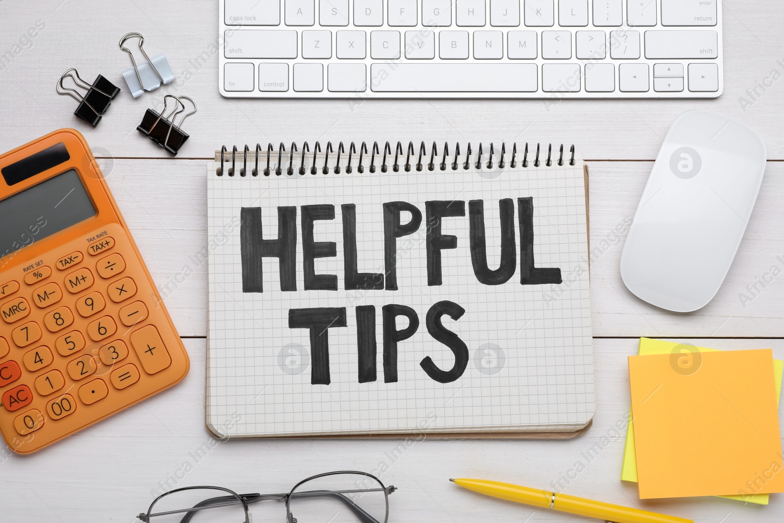 Photo of Helpful Tips. Flat lay composition with notebook, calculator and computer keyboard on white wooden table