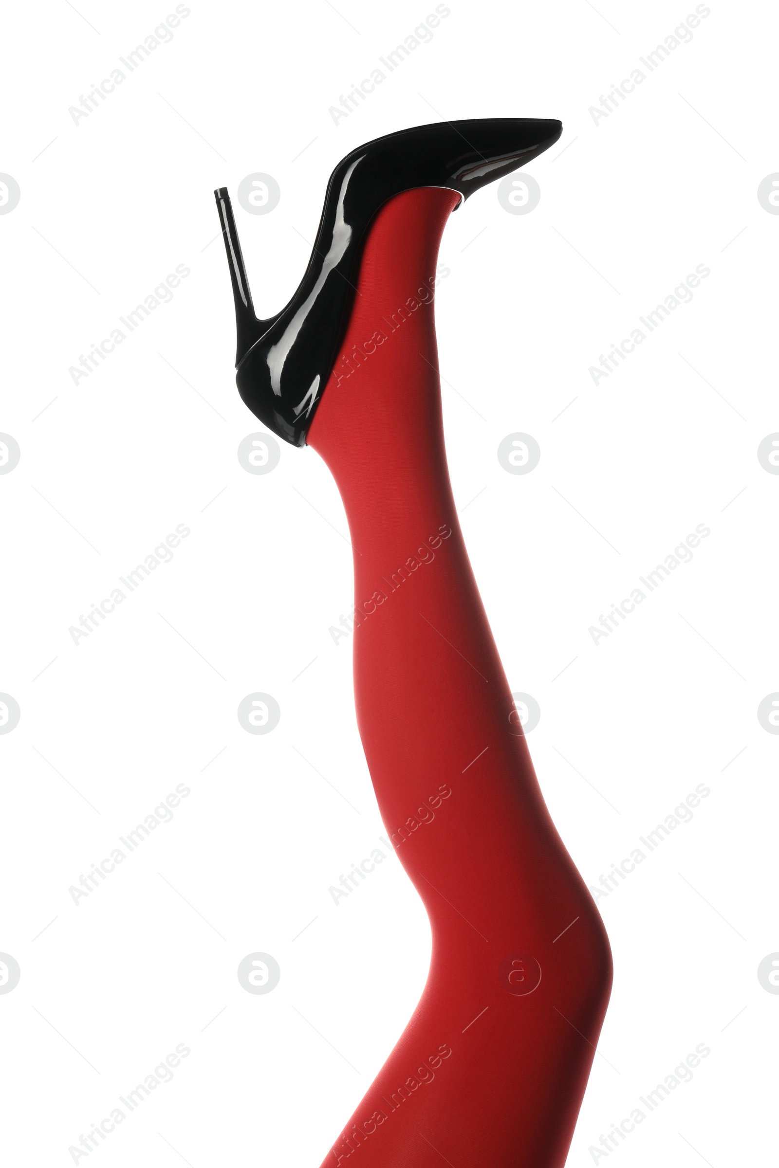 Photo of Woman wearing bright tights and high heel shoe on white background, closeup