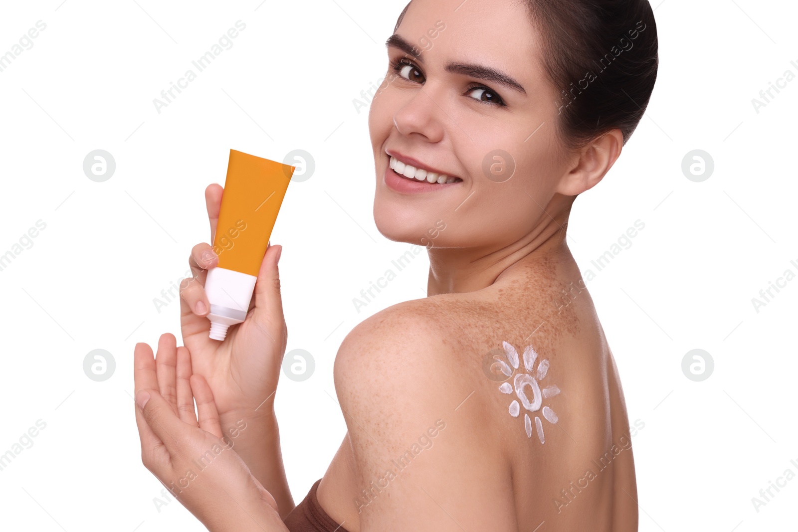 Photo of Beautiful young woman holding tube of sun protection cream against white background