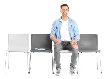 Young man waiting for job interview on white background