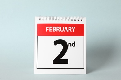 Calendar with date February 2nd on light background. Groundhog day