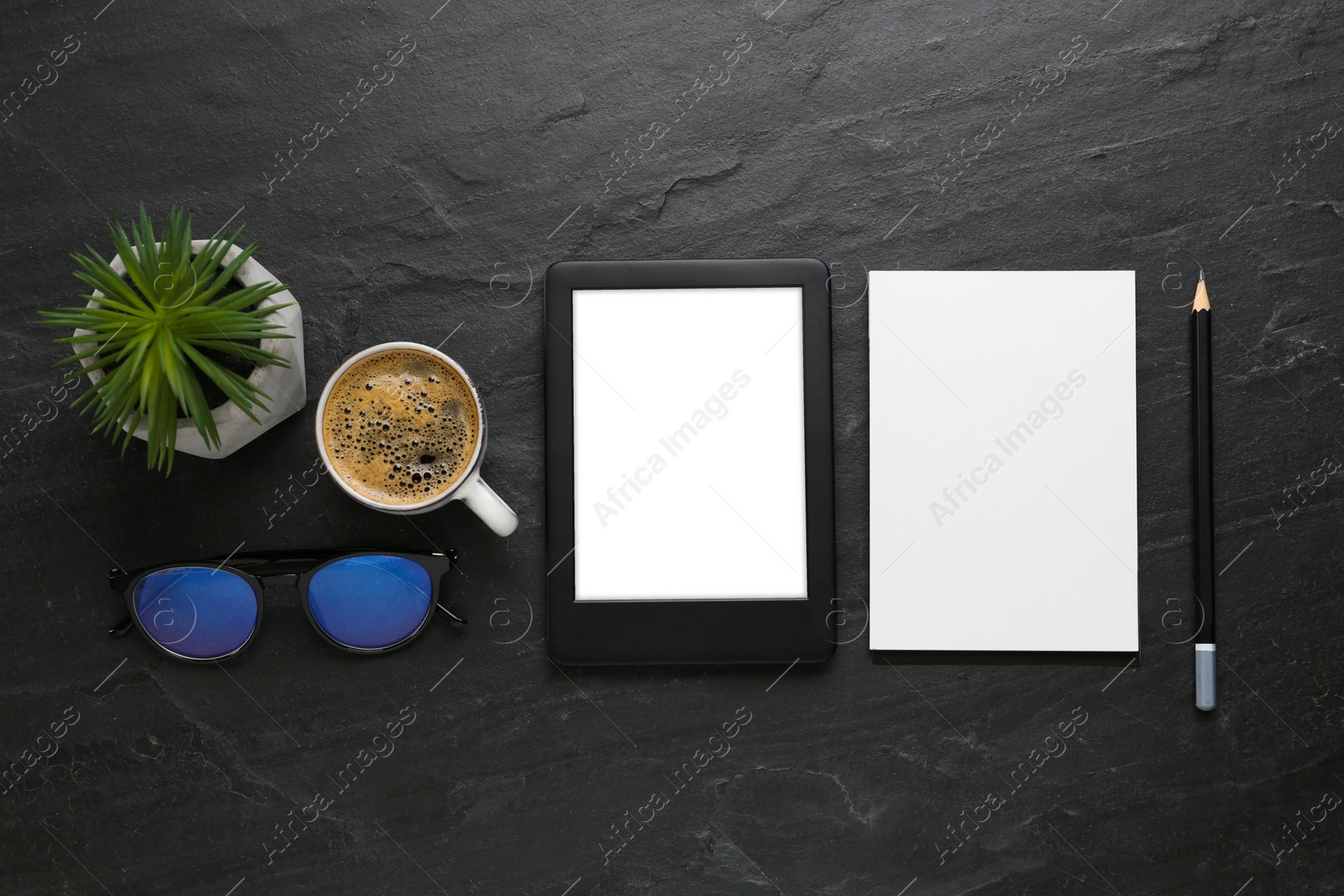 Photo of Flat lay composition with modern e-book reader on black table